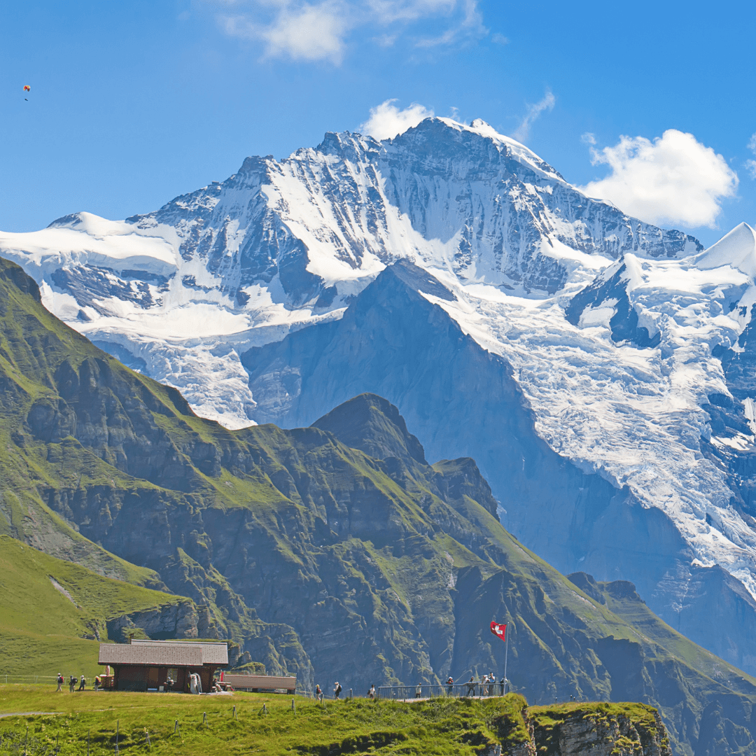 Scenic Switzerland and Jungfraujoch Adventure Embark on a thrilling journey to Jungfraujoch, the Top of Europe, with a cogwheel train ride through picturesque alpine landscapes. Relish panoramic views of the Swiss Alps, walk through the enchanting Ice Palace, and enjoy the Sphinx Terrace. Experience the world's first revolving cable car to Mount Titlis and enjoy Swiss chocolate shopping in Lucerne.