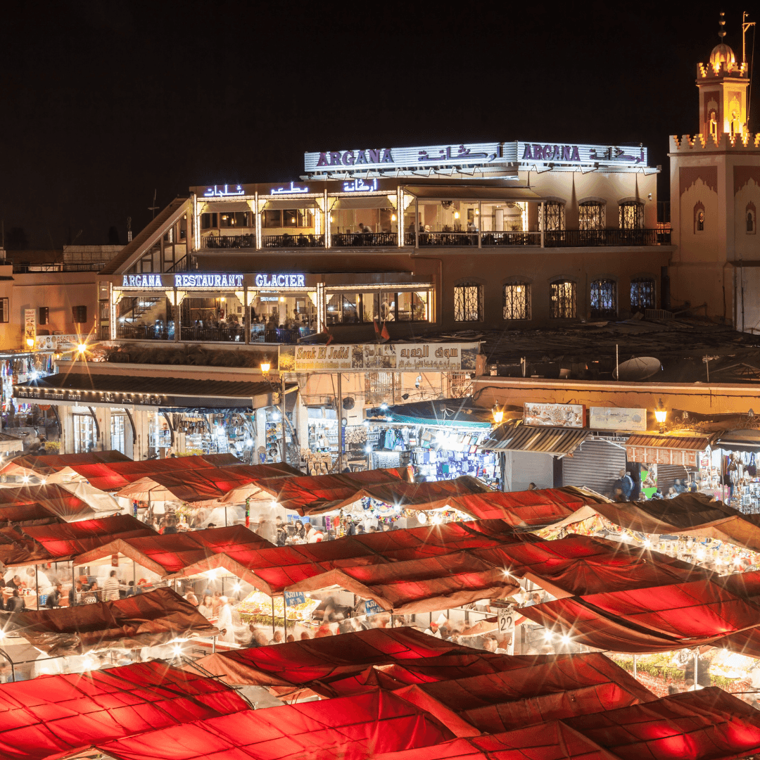Immerse yourself in the vibrant atmosphere of Marrakech. Explore the famous Jemaa El-Fna Square, a bustling marketplace that transforms into a lively festival of food, music, and performance by night.