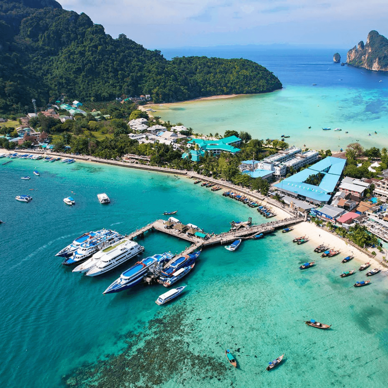 Snorkeling in Phi Phi Island's Emerald Waters exposes you to vivid coral reefs and a plethora of tropical fish, making it a paradise for marine enthusiasts and photographers alike.