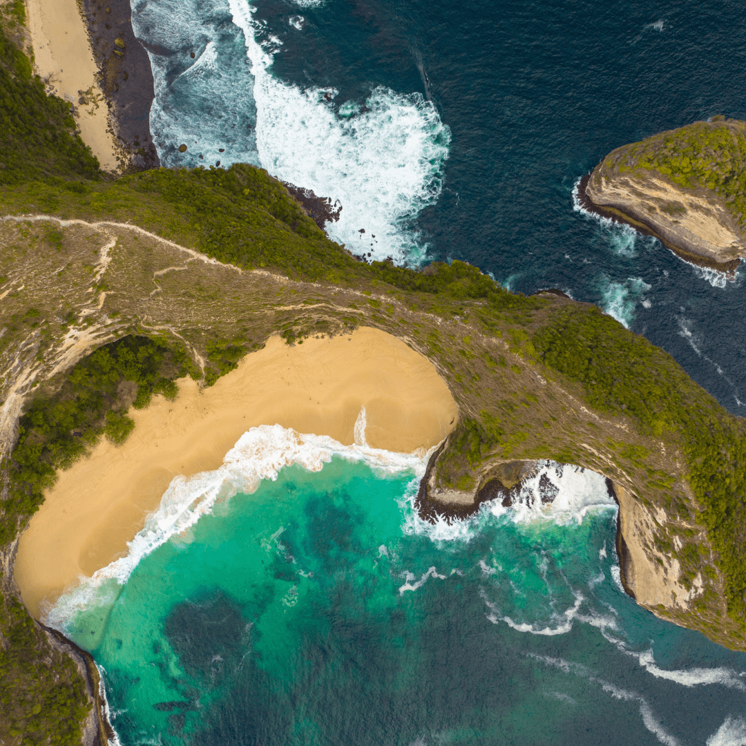 Kelingking Beach, with its breathtaking cliffside views resembling a T-Rex. Relax at Crystal Bay, famous for its clear waters and white sandy beach.