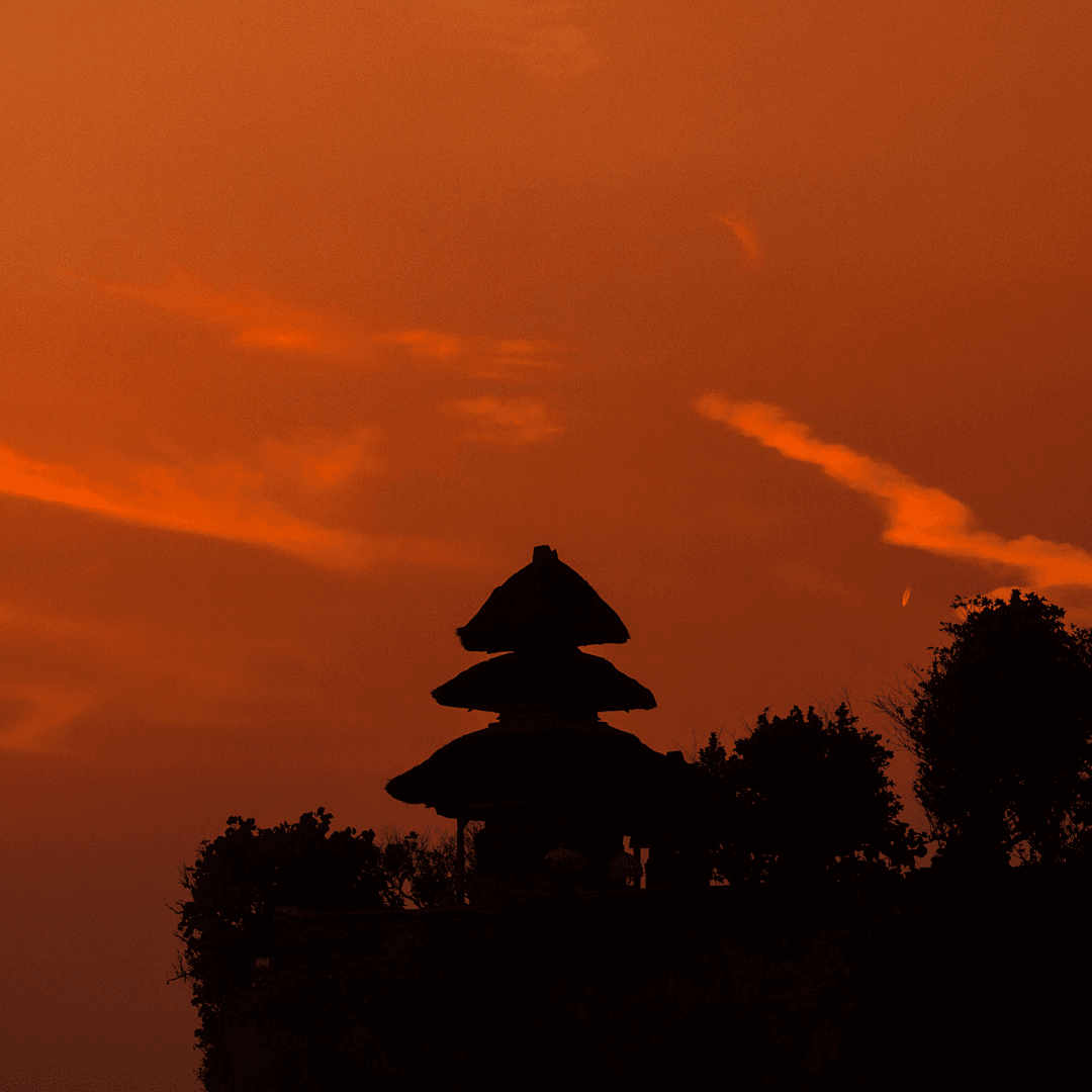 Iconic Temples at Sunset: Experience the dramatic beauty of Uluwatu and Tanah Lot temples as the sun sets, casting magical hues over the ocean.