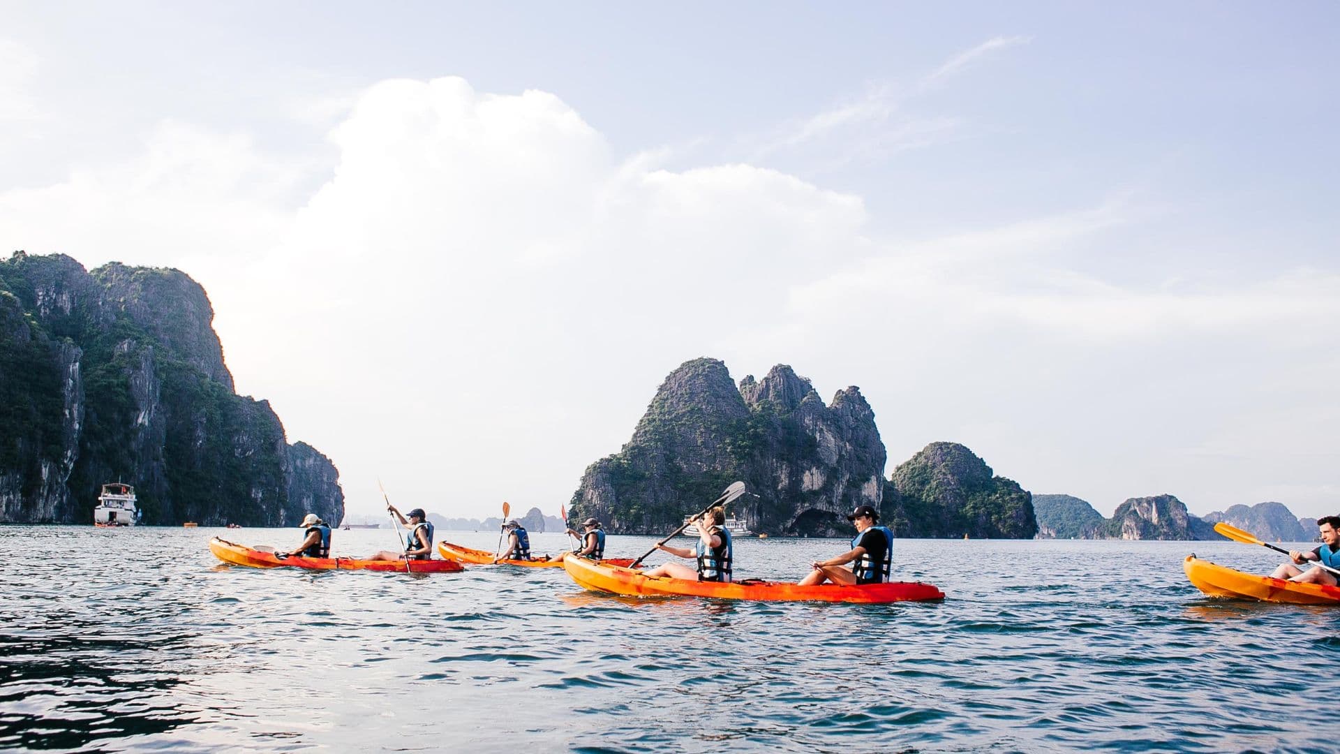 Luxury Halong Bay Cruise – Overnight cruise with kayaking, swimming, sunset party, and scenic limestone cliffs.
